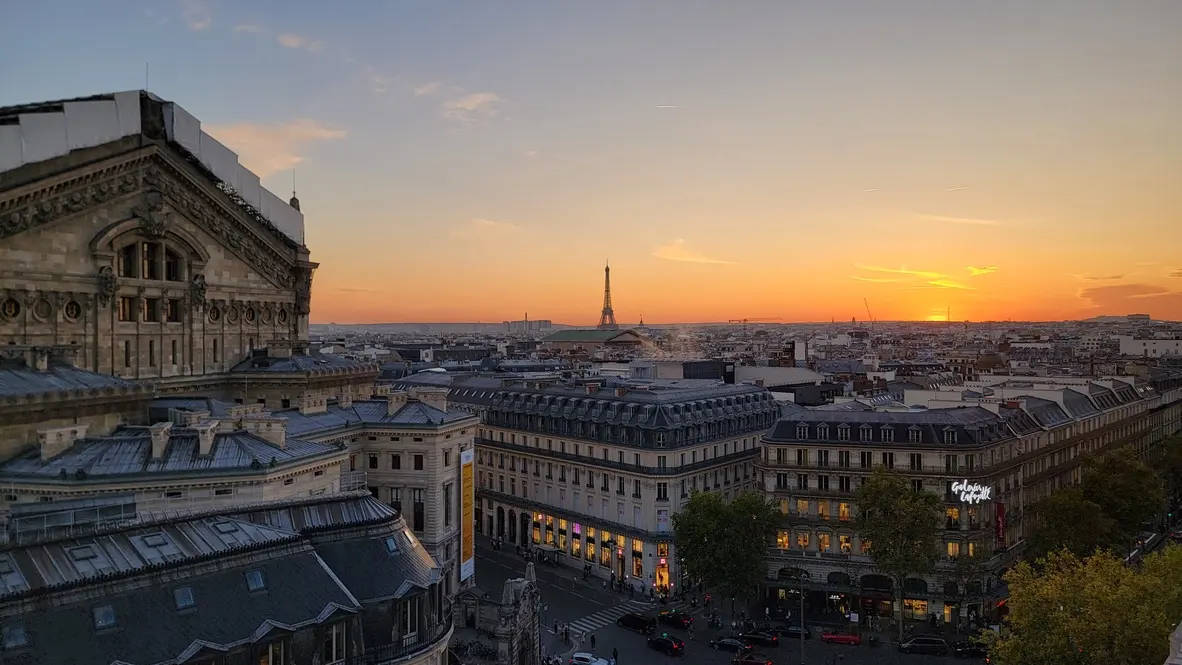 City lights at sunset beneath an open sky